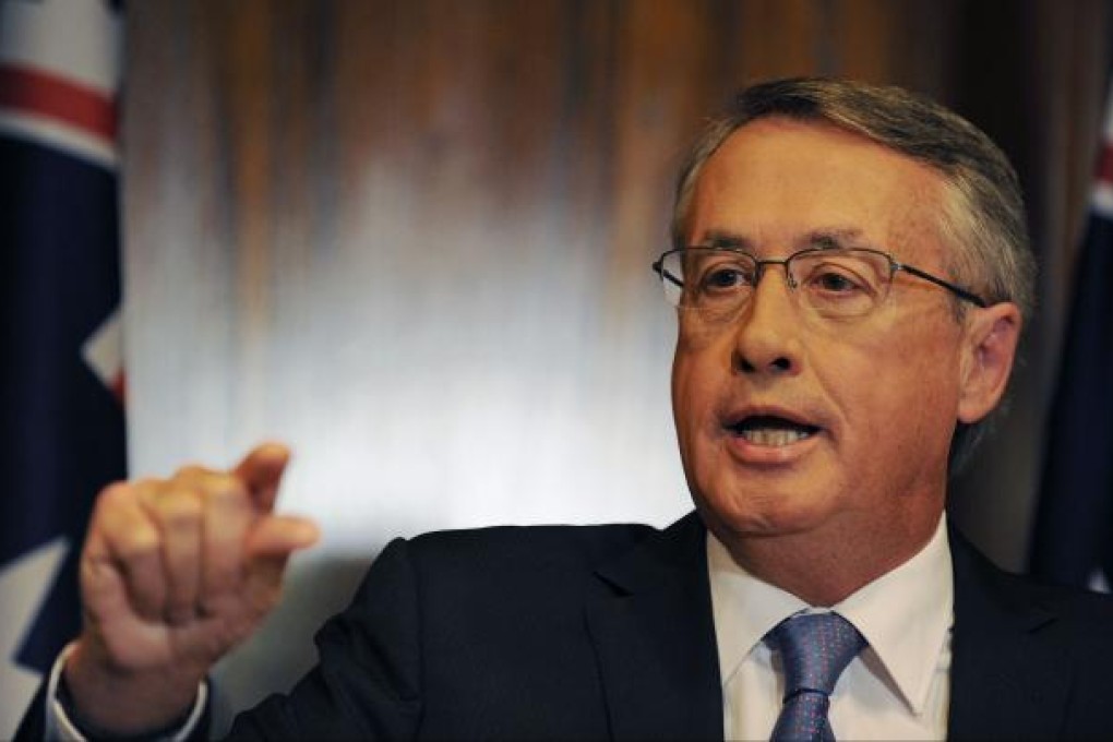 After sailing through the global financial crisis unscathed, Australia’s growth forecasts have been cut by Treasurer Wayne Swan, citing global volatility and falling revenue. Photo: AFP