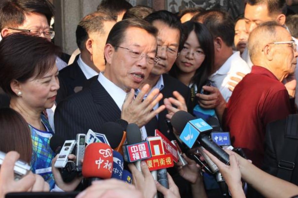 Frank Hsieh with his wife Yu Fang-chih (left) as addresses Chinese media during a visit to Dongshan Island, Fujian province. Photo: AFP