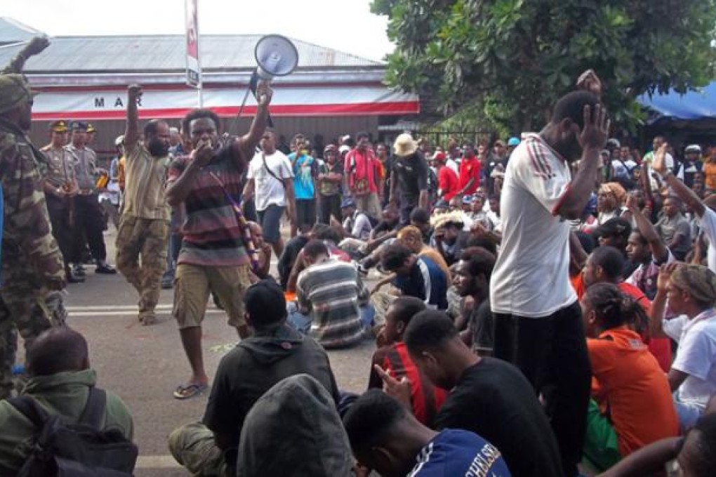 A group of Papuan pro-independence protestors rally outside the University of Papua in Manokwari located in Papua province on Tuesday. Photo: AFP