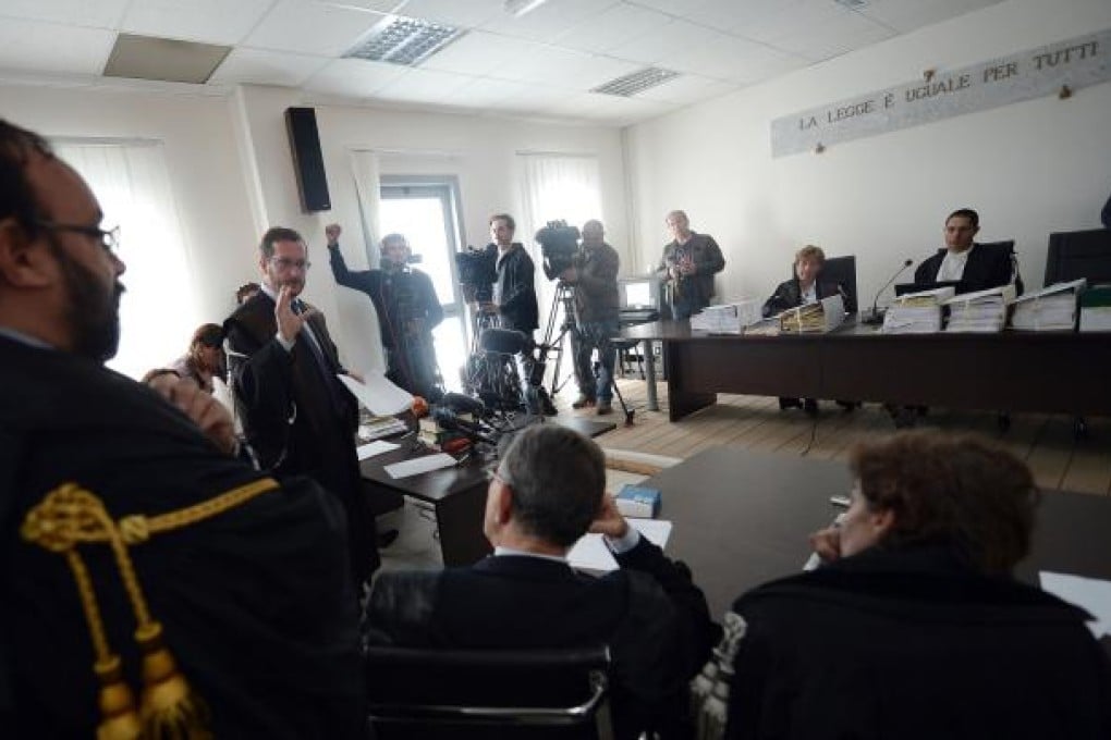 A lawyer (centre) addresses the court in charge of the trial of six Italian scientists and a government official charged with manslaughter for underestimating the 2009 earthquake in L'Aquila, Italy. Photo: AFP