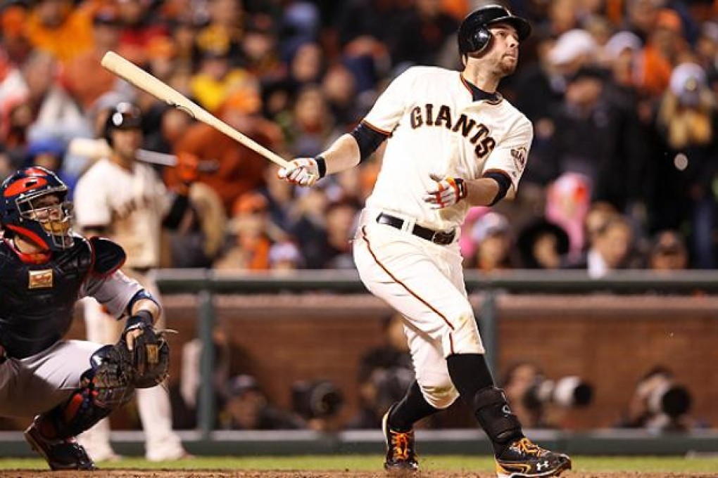 Giants' Brandon Belt hits a home run against the Cardinals. Photo: AFP