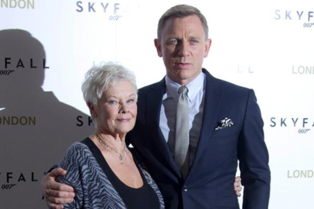 Judi Dench and Daniel Craig pose for photographs at the <i>Skyfall</i> photo call at the Dorchester Hotel in London on October 22. Photo: AP