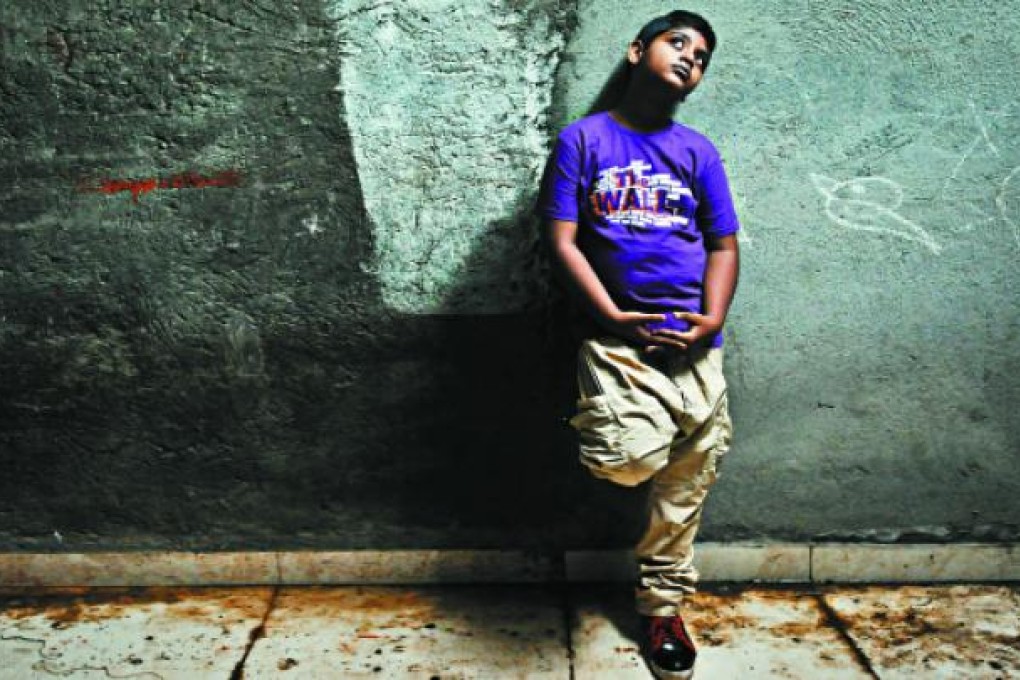 Azhar Ismail, 14, who played the young Salim in the film, still dreams of a new life. "I want to be a big star," he says. Photos: Gethin Chamberlain, Ishika Mohan and Reuters