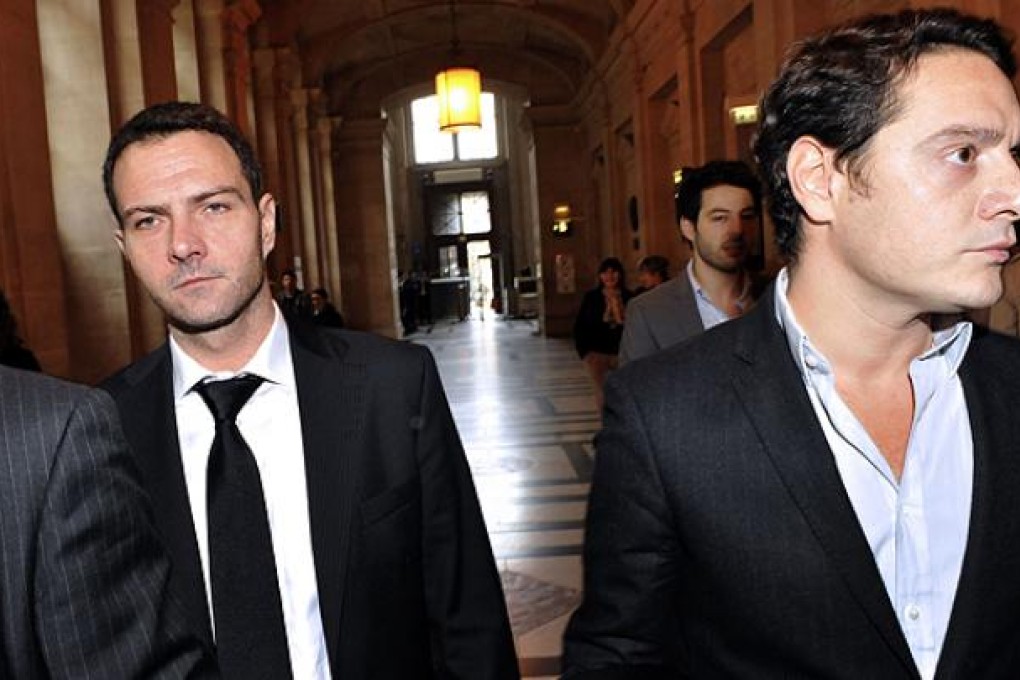 French rogue trader Jerome Kerviel (left) flanked by his lawyer David Koubbi arrives at a Paris court on Wednesday. Photo: AFP