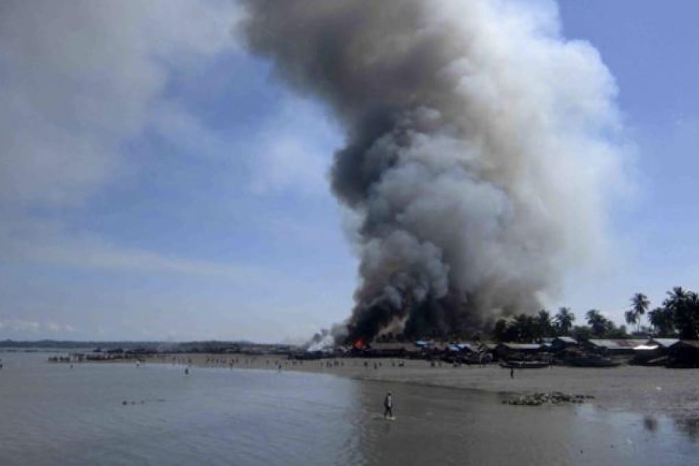 A fire burns in the Pike Sake quarter in Kyout Phyu, Rakhine state, western Myanmar, on Wednesday. Photo: EPA