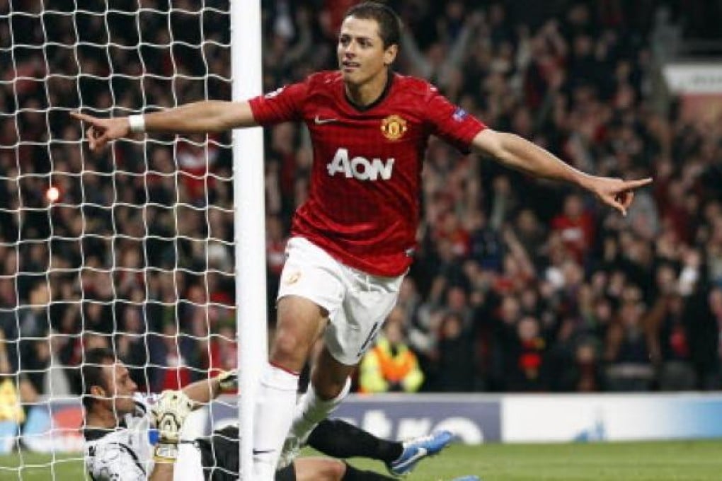 Manchester United's Javier Hernandez celebrates after he scores the third goal during their Champions League Group H soccer match against SC Braga in Manchester on Tuesday. Photo: AP