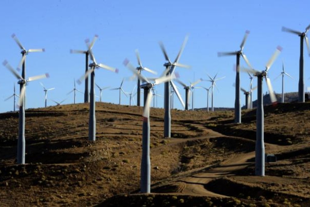 Wind turbines are productive but grid operators need to install special equipment to handle their intermittent output. Photo: EPA