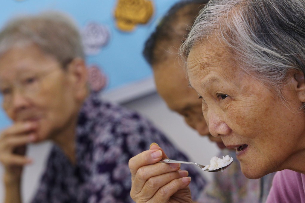 Elderly people receive a free meal from People's Food Bank. Photos: K.Y. Cheng, Nora Tam, Thomas Yau