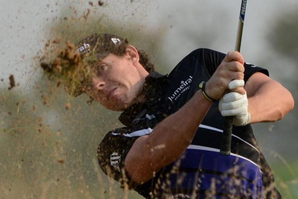 Rory McIlroy plays from the rough on the 17th hole before finishing at 12 under par after the second round of the BMW Masters at the Lake Malaren Golf Club. Photo: AFP