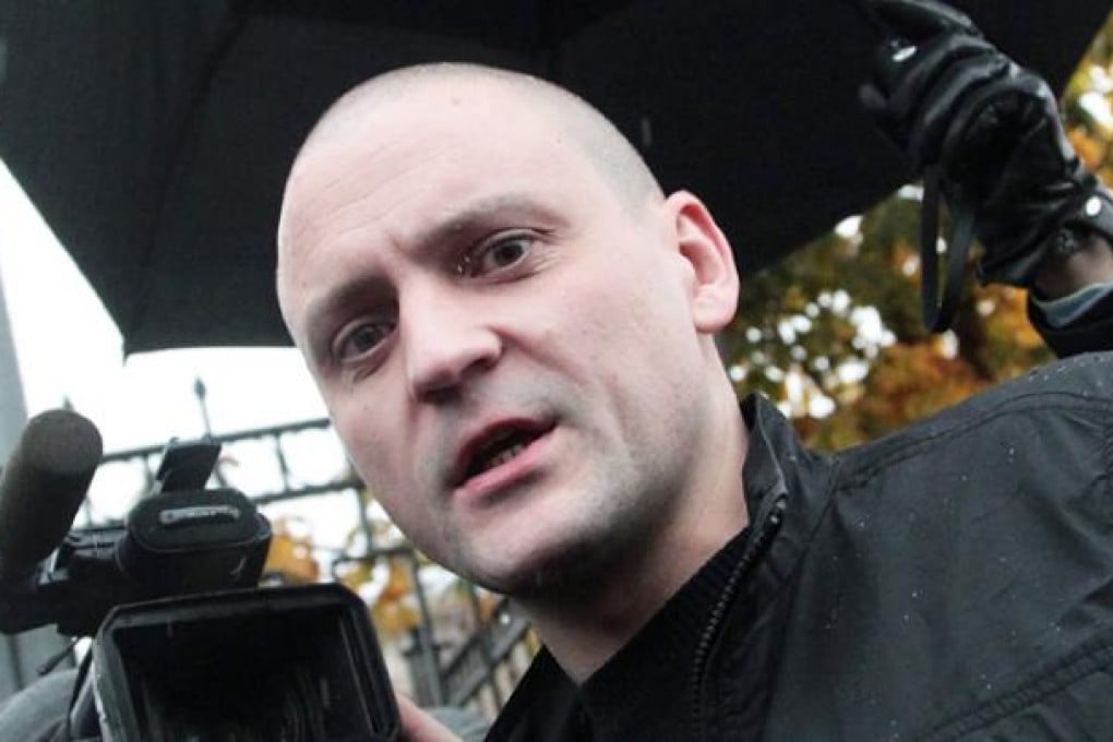 Sergei Udaltsov, the leader of the Left Front movement, arrives at the Investigation Committee office in Moscow on Friday. Photo: EPA