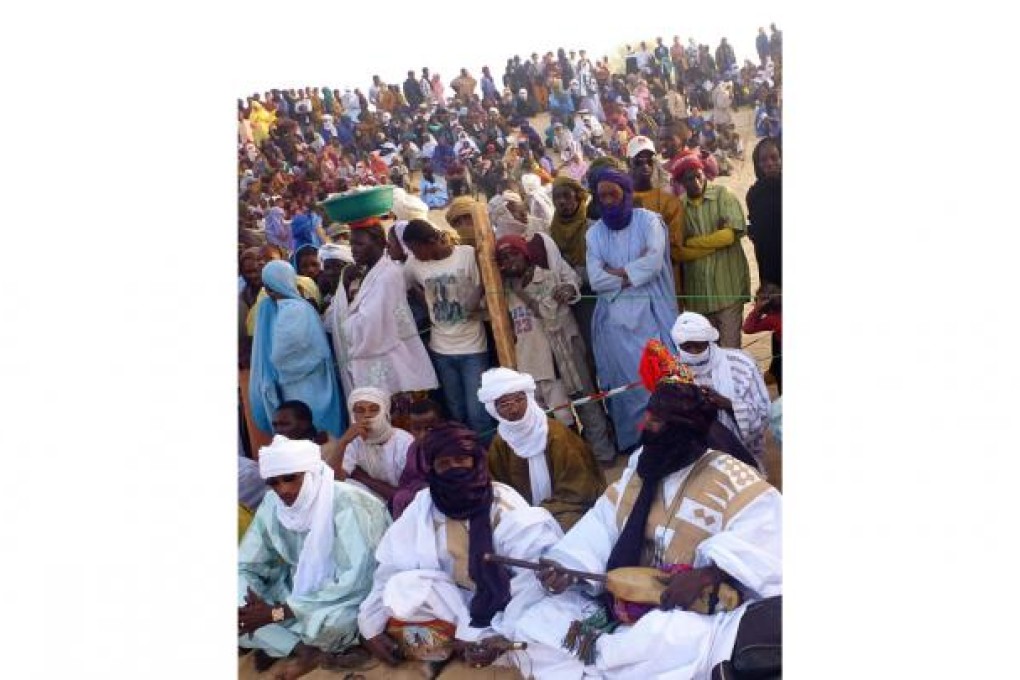 Musicians and some of the fans at this year's Festival of the Desert on the edge of Timbuktu. Photo: AFP