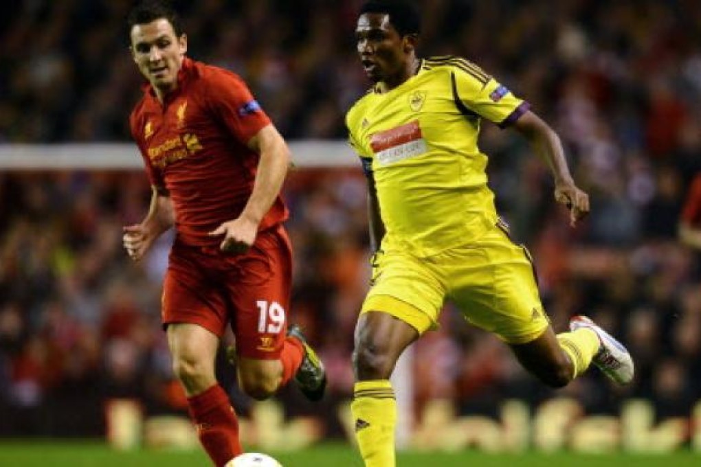 Anzhi Makhachkala's Cameroonian forward Samuel Eto'o (right) vies with Liverpool's English midfielder Stewart Downing during their UEFA Europa League football match at Anfield in Liverpool on Thursday. Photo: AFP