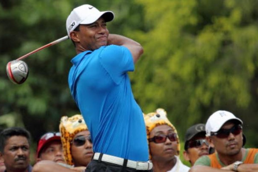 US golfer Tiger Woods watches his shot during the CIMB Asia Pacific Classic golf tournament in Kuala Lumpur on Thursday. Photo: EPA