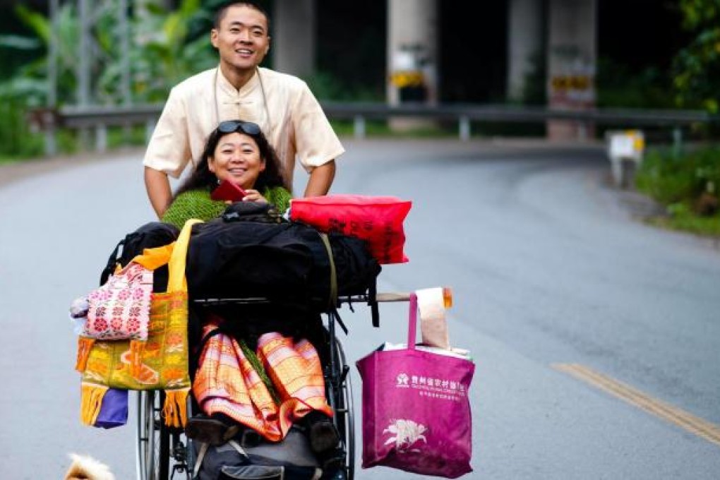Fan Meng, 26, and his 53-year-old mother Kou Minjun hit the road with supplies. Photo: Imaginechina
