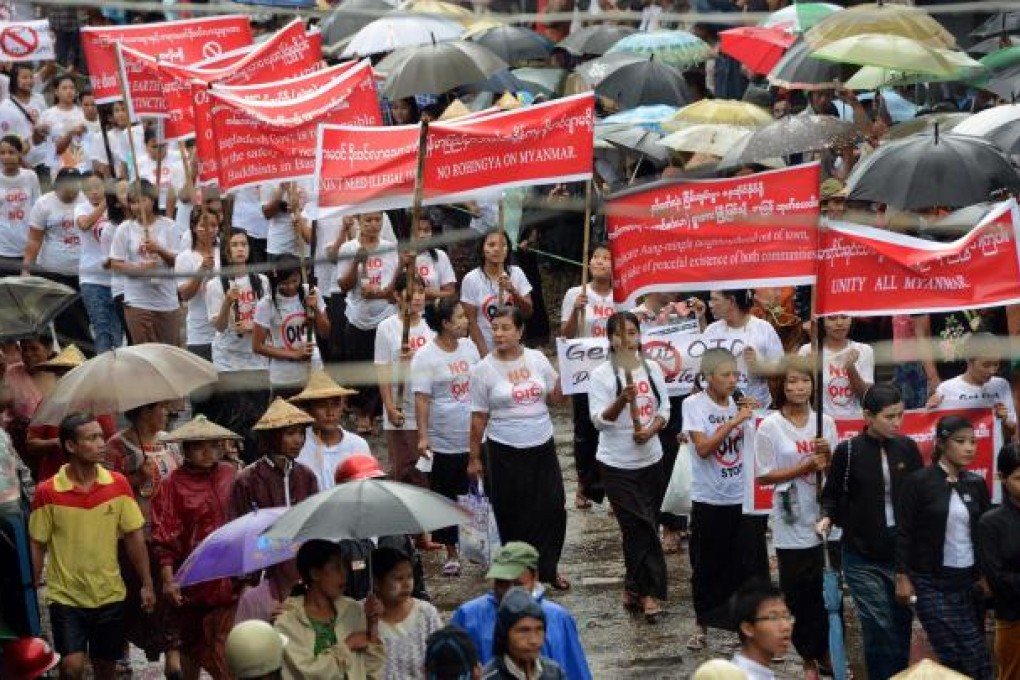 Ethnic Rakhine Buddhist women demonstrate against plans by an Islamic organisation to open an office in Sittwe. Photo: AFP