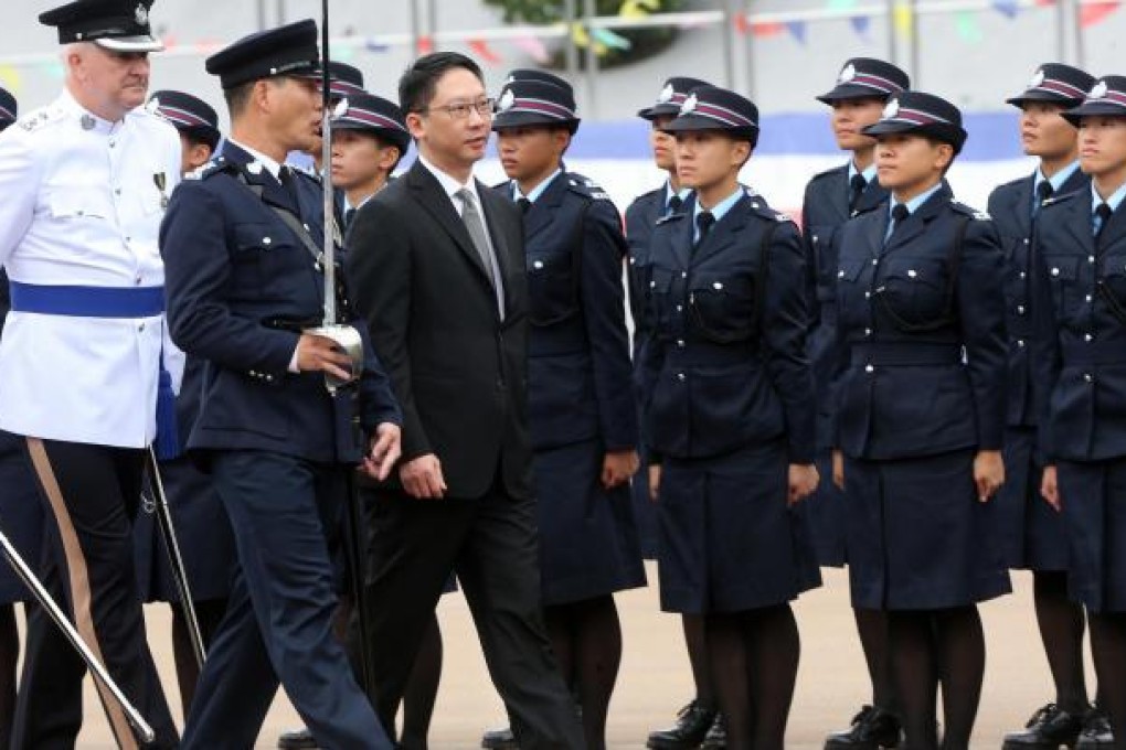 Justice minister Rimsky Yuen Kwok-keung inspects a passing-out parade of recruits at the Police College yesterday. Photo: Sam Tsang