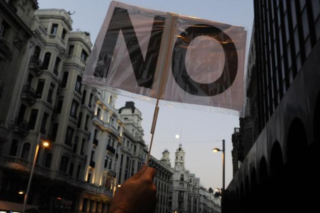 Demonstrators in Madrid oppose the government's hefty spending cuts. Photo: AFP