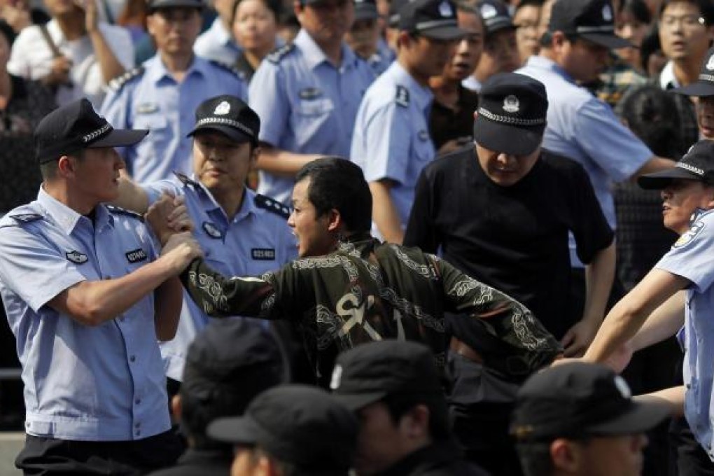 Police arrest a demonstrator. Photo: Reuters
