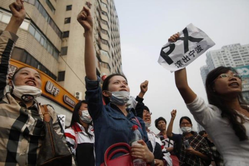 Demonstrators march against the plant. One resident said the crowd did not believe the government would halt the project. Photo: Reuters