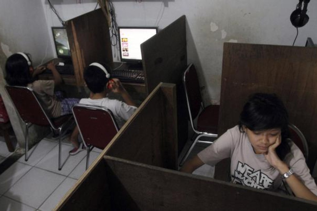 Many young Indonesians using Facebook are unaware of the dangers of allowing strangers to see their personal information online. Photo: AP
