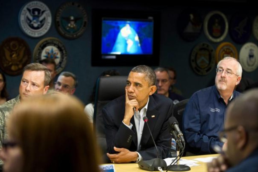 US President Barack Obama receives a briefing on the hurricane at the Federal Emergency Management Agency in Washington on Sunday. Photo: AFP