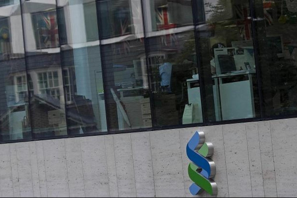 StanChart aims to reach a group deal over US charges on Iran.