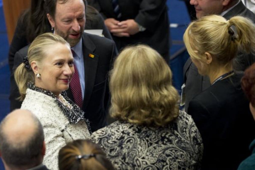 US Secretary of State Hillary Clinton (left) greets US Embassy employees and their families at the US Embassy in Sarajevo on Tuesday. Photo: AFP