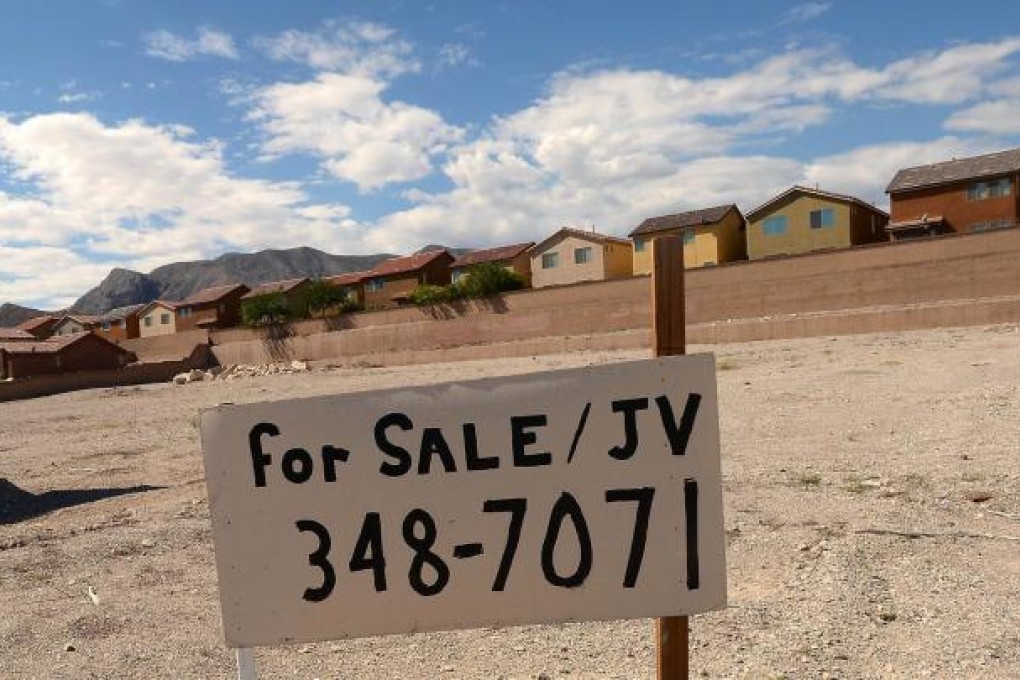 A 'for sale' sign in the foreground of houses in the northwest residential neighbourhood in Las Vegas. Photo: AFP