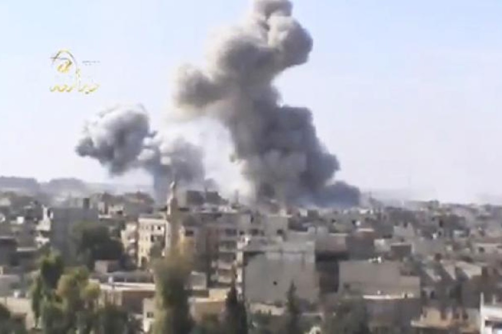 Smoke rises from buildings in Damascus after heavy bombing, as shown on the Ugarit news network. Photo: AP