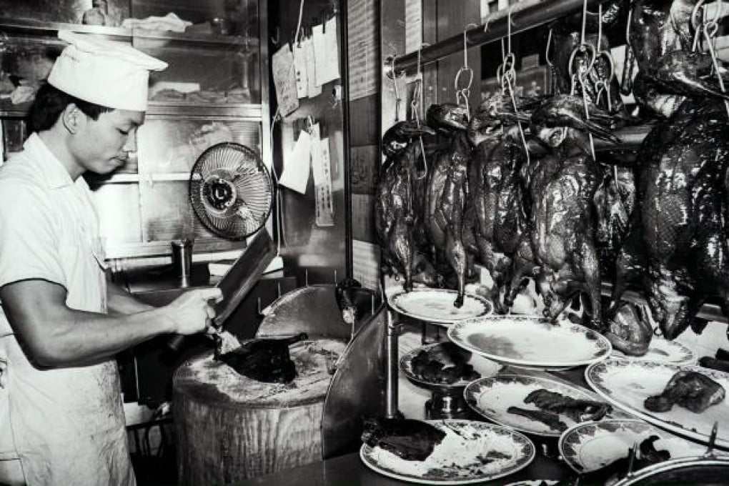 A chef chopping a roast duck in the Yung Kee restaurant. Photo: SCMP