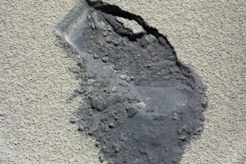 Images released by Nasa show the Curiosity rover taking a scoop of dirt from the surface of Mars. The rover uses an X-ray imager to analyse the atomic structure of crystals discovered in the soil. Photo: AP