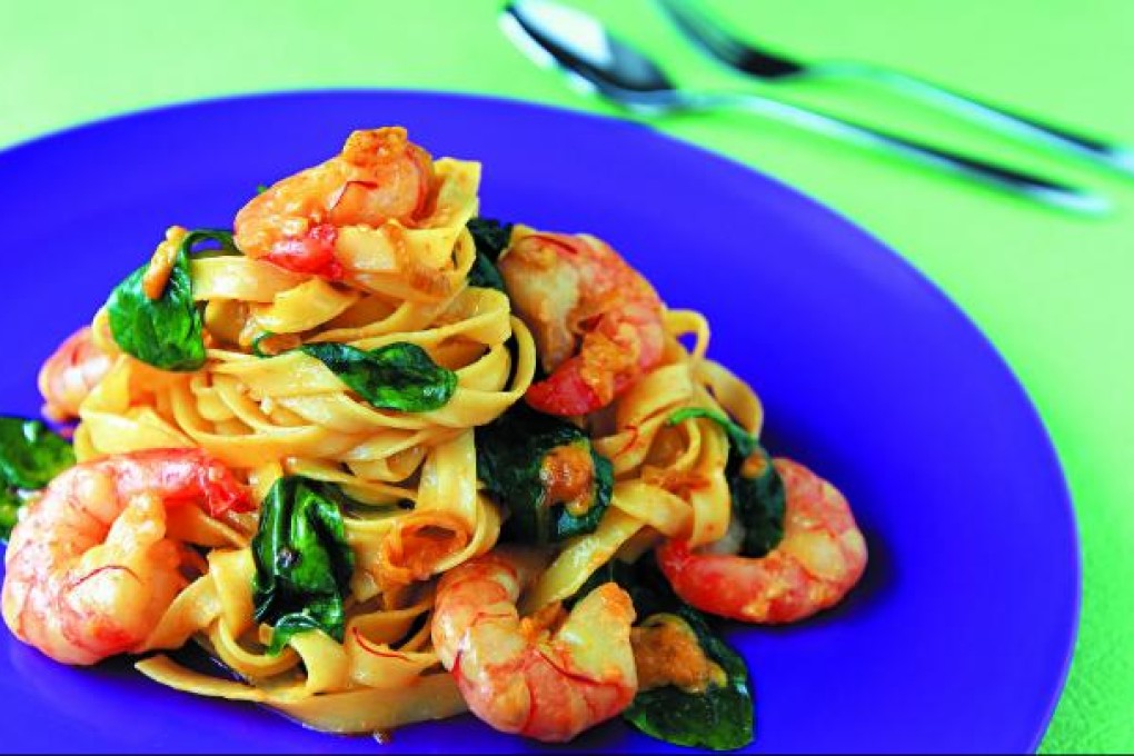 Tagliatelle with saffron shrimp and baby spinach