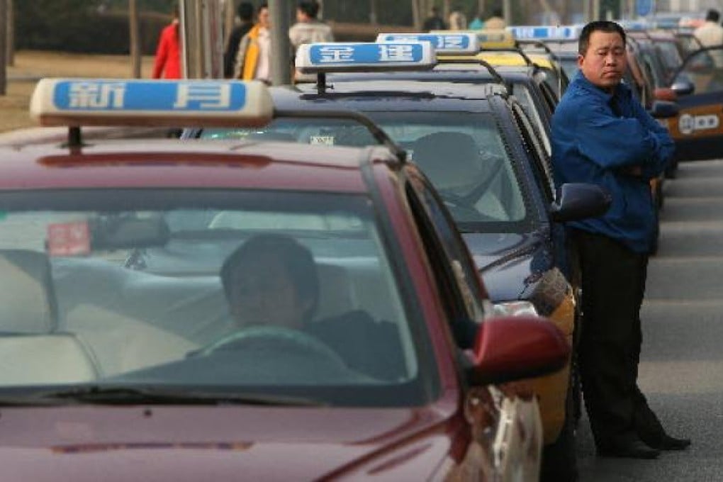 Beijing authorities have ordered taxi drivers to remove all of the window cranks by the passengers’ seats. Photo: SCMP