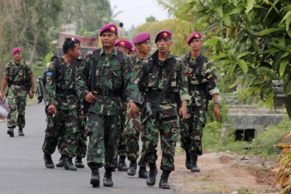 Indonesian soldiers patrol after ethnic clashes in Lampung province. Photo: AP