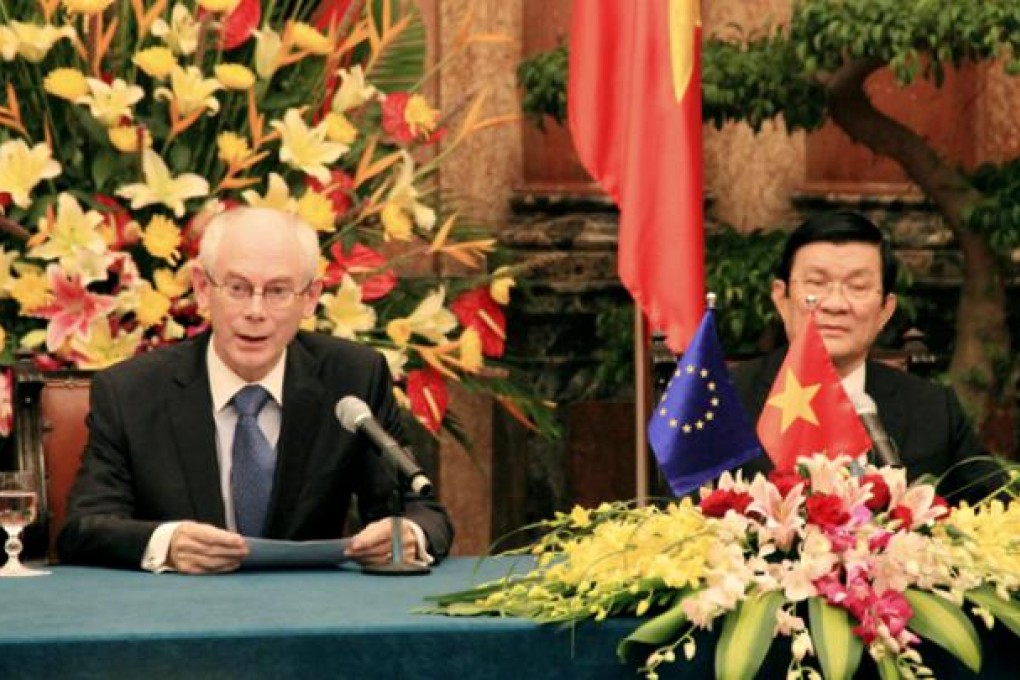 European Council President Herman Van Rompuy (left) speaks during a meeting with Vietnamese President Truong Tan Sang (right) in Hanoi on Wednesday. Photo: AP