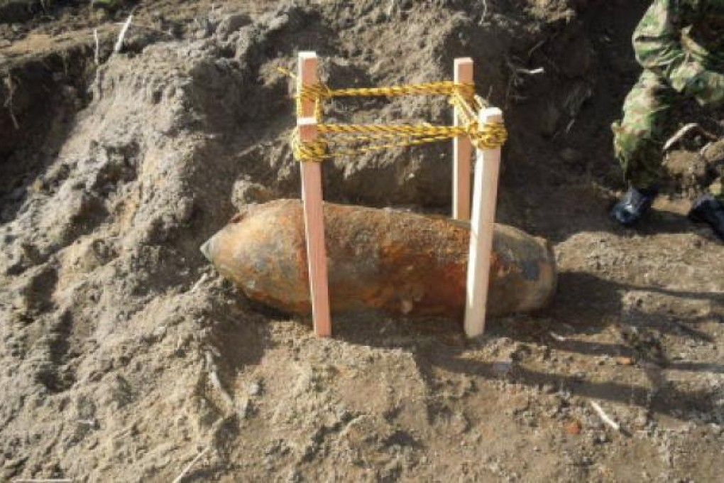 A huge unexploded wartime bomb found at a construction site near the runway of Sendai Airport in Japan. Photo: AFP