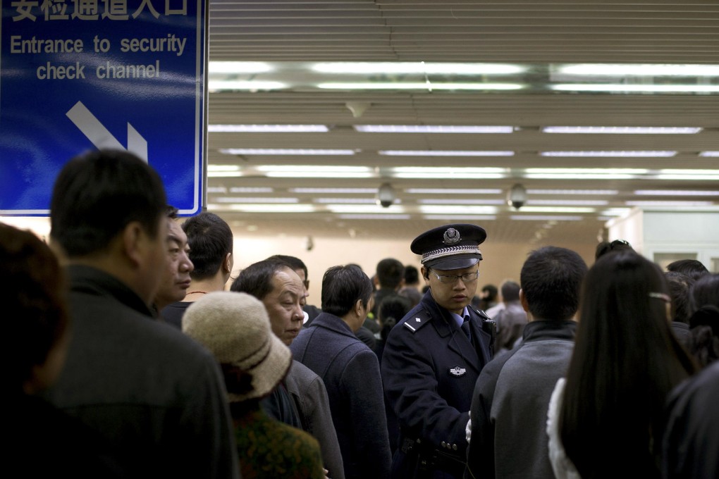 People line up for security checks inside a tunnel leading to Tiananmen Square. Photo: AP
