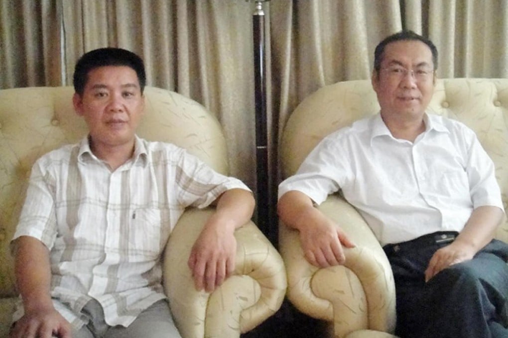 Huang Liyi (left) and his lawyer