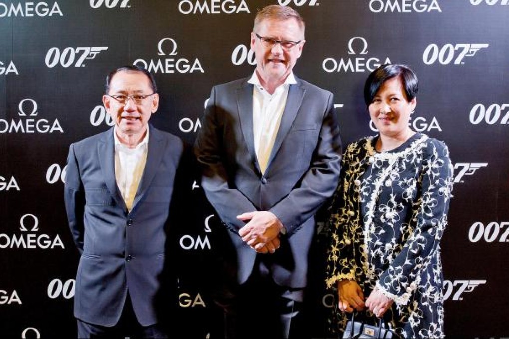 Emperor Group's Albert Yeung Sau-shing , Kevin Rollenhagen of Omega and Semon Luk Siu-man get a taste of OO7 magic.