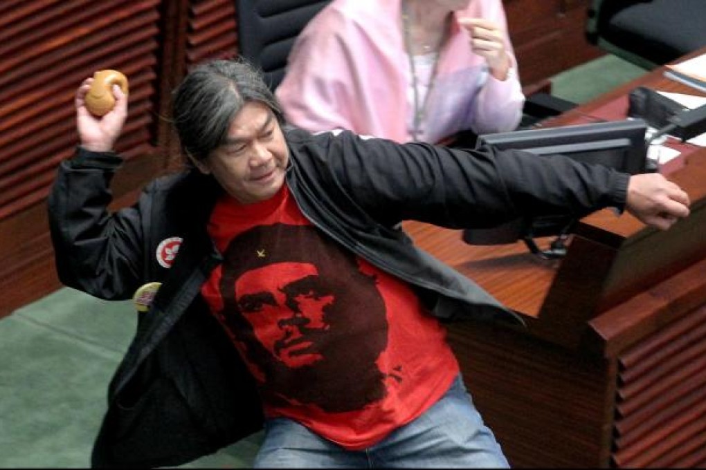 Leung Kwok-hung hurls plastic faeces in Legco. Photo: K.Y. Cheng