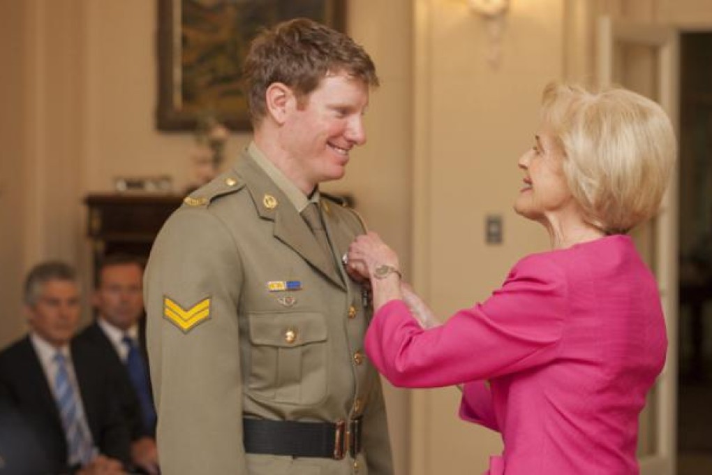 Quentin Bryce, Governor-General of Australia (right), presents Corporal Daniel Keighran with the Victoria Cross at Government House in Canberra. Photo: AFP