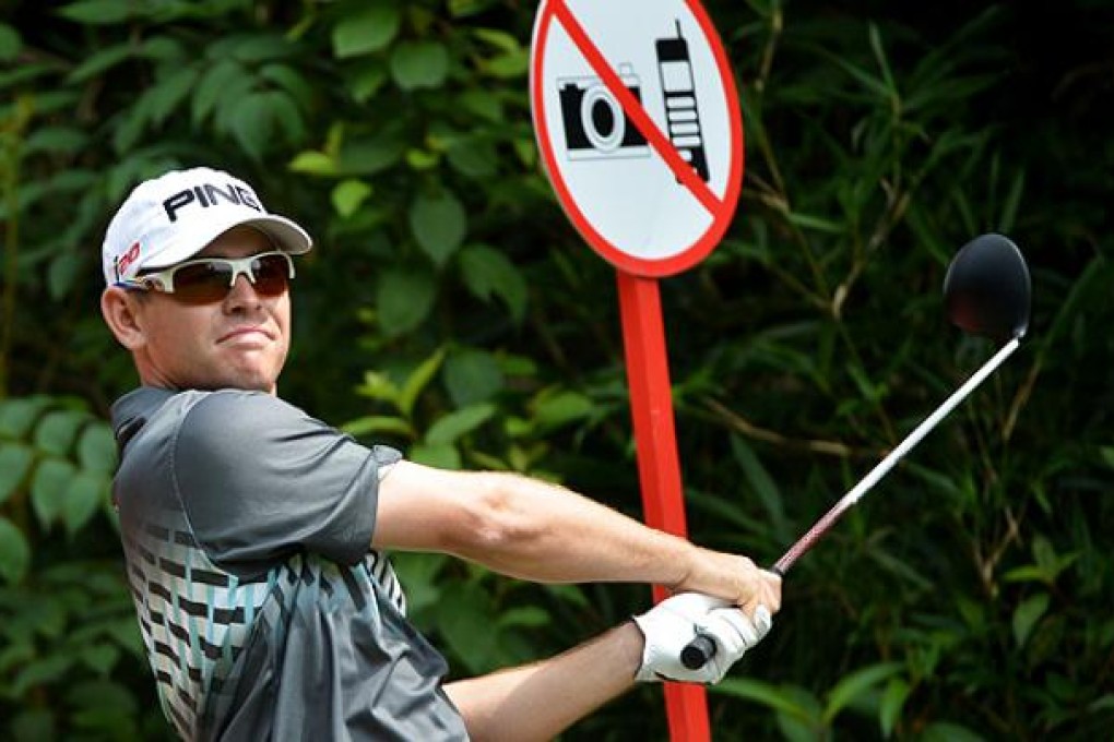 Louis Oosthuizen of South Africa tees off at the 15th hole in the first round of the HSBC Champions at Mission Hill in Shenzhen. Photo: AFP