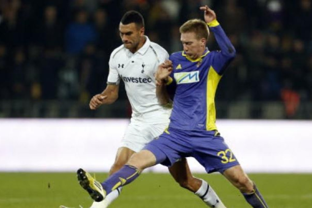 Tottenham's Steven Caulker (left) being challenged by Maribor's Robert Beric. Caulker and Thomas Ince have reportedly been charged by Serbian police for their role in an on-field brawl. Photo: AP