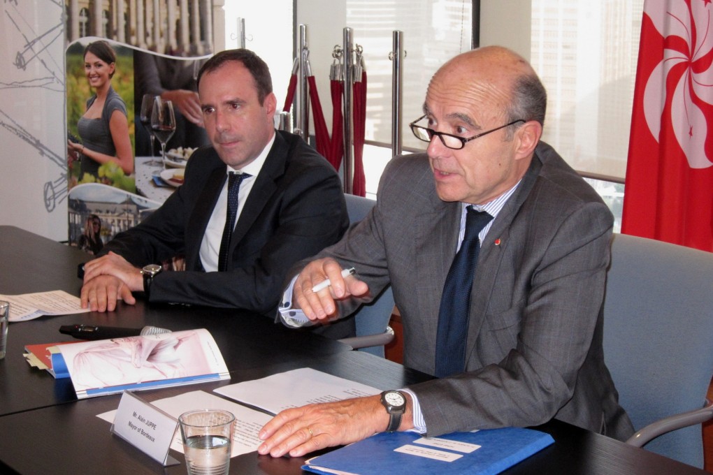 Alain Juppe, right, answers questions at the launch of the Wine and Dine Festival. Photo: Stephen Quinn