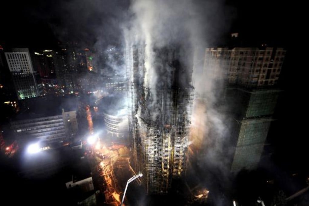 Firefighters battle the blaze on November 15, 2010. Photo: AFP