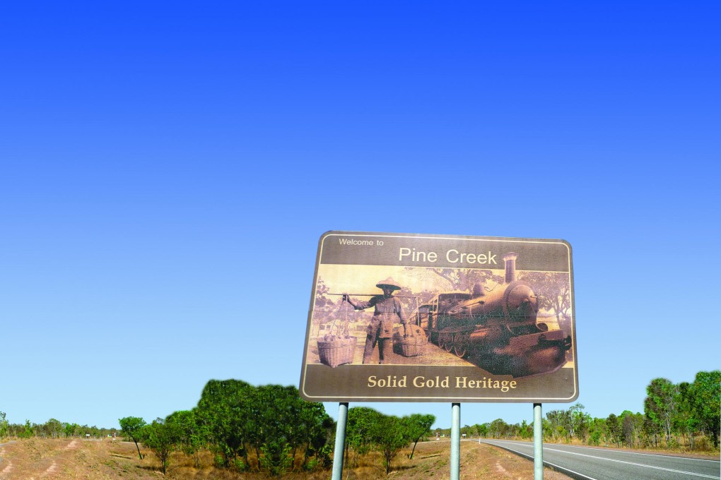 A sign on the outskirts of town hints at Pine Creek's colourful past. Photo: Helen Leavey