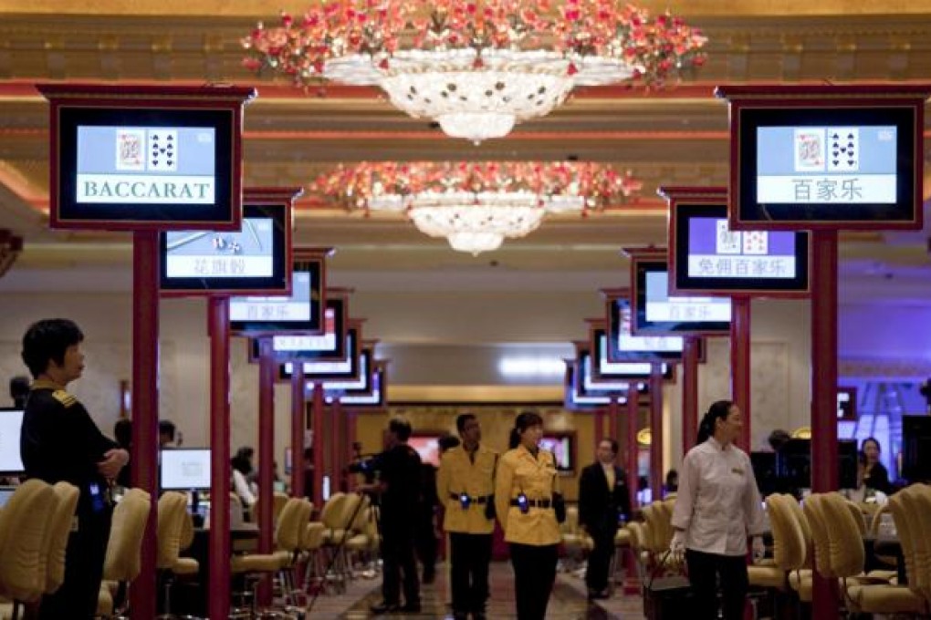 Lights are on for the middle-class sector of visitors to Macau’s casinos. This group helped to counter the lack of high rollers. Photo: Bloomberg