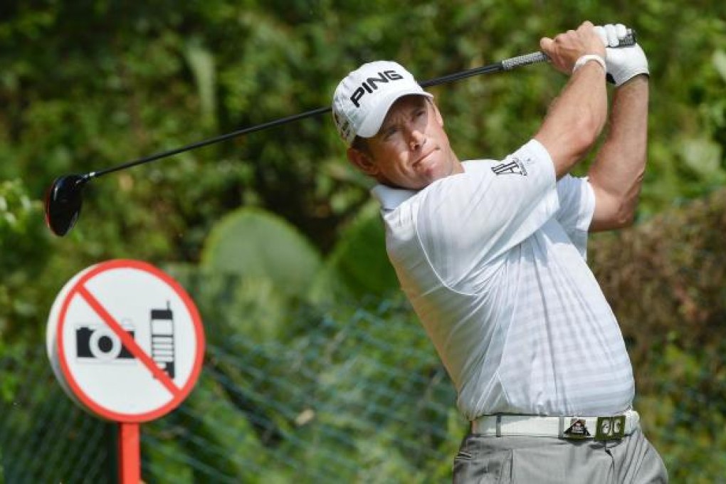 Lee Westwood tees off at the 11th hole yesterday. Photo: AFP