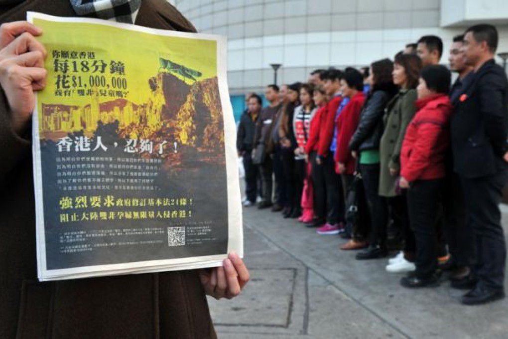 A protest depicting mainland tourists as locusts. Photo: AFP