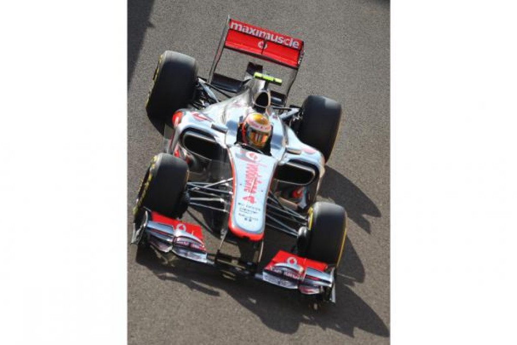 McLaren ace Lewis Hamilton on his way to pole position for today's Abu Dhabi Grand Prix at the Yas Marina Circuit. Photo: EPA